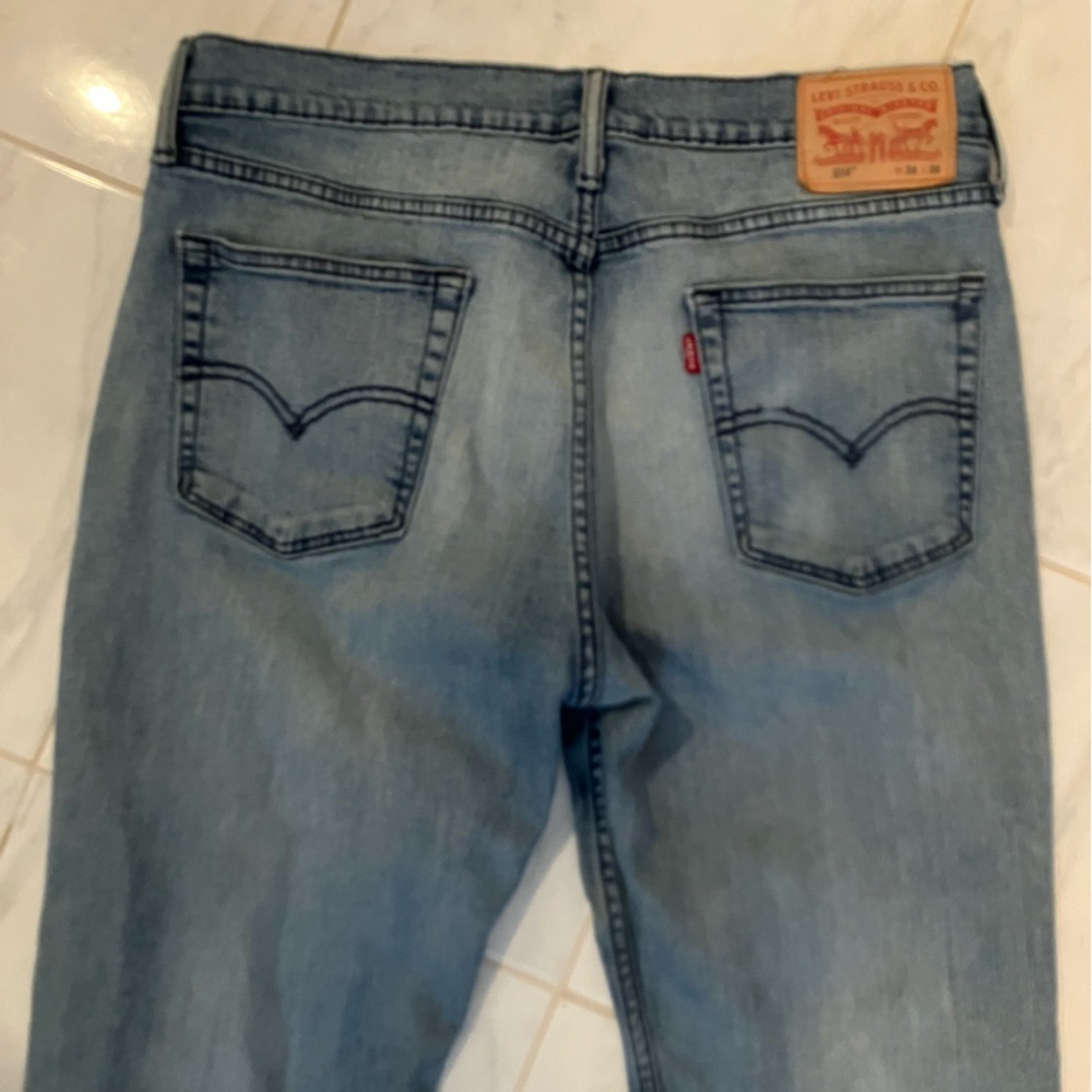 Levi’s blue denim jeans.  Red tab. Preloved / distressed